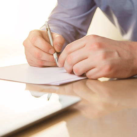 male-hands-with-pen-cup